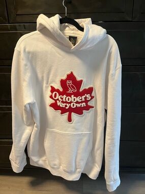 October's Very Own (OVO) White Hoodie with Red Maple Leaf Logo